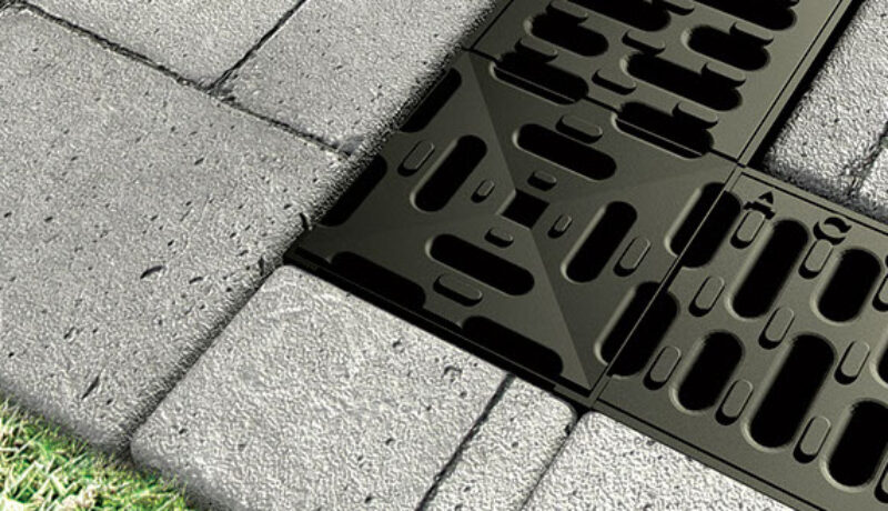 A sample drain system installed in a side walk